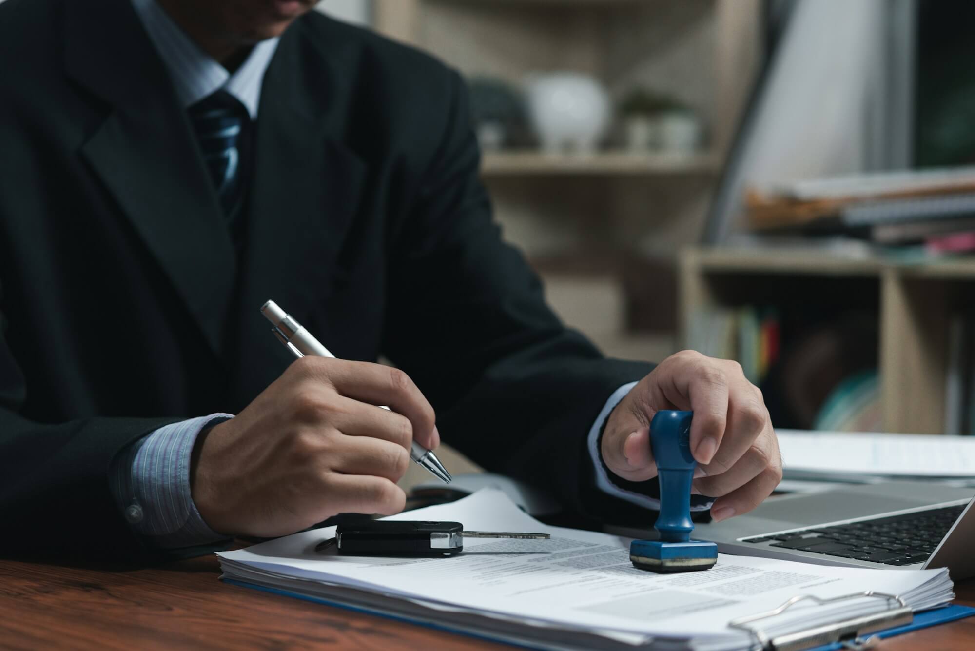 businessman-signing-a-contract-for-buying-of-selling-a-car-car-rental-service-insurance-and-contra.jpg