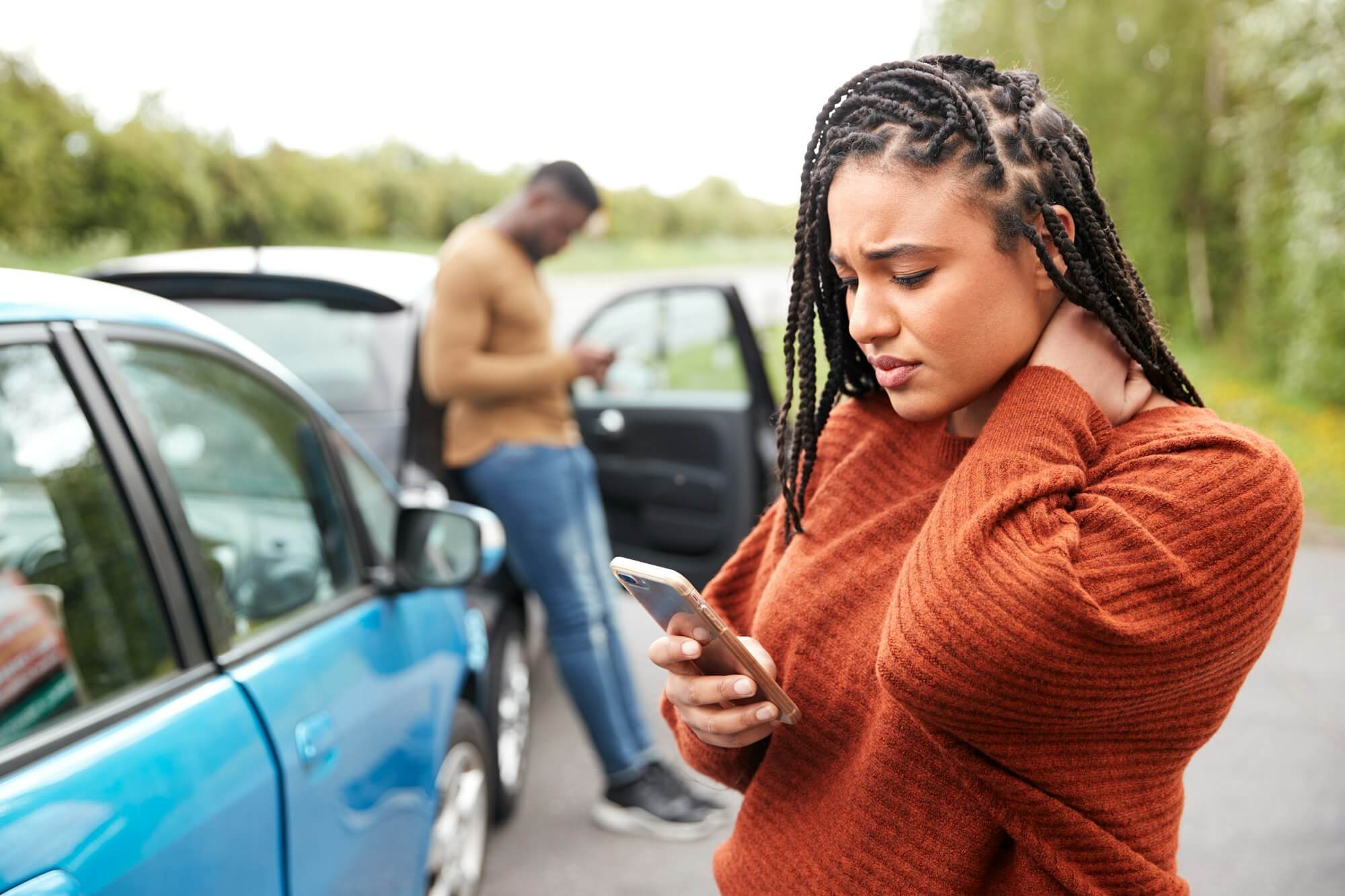 female-motorist-involved-in-car-accident-calling-insurance-company-or-recovery-service.jpg
